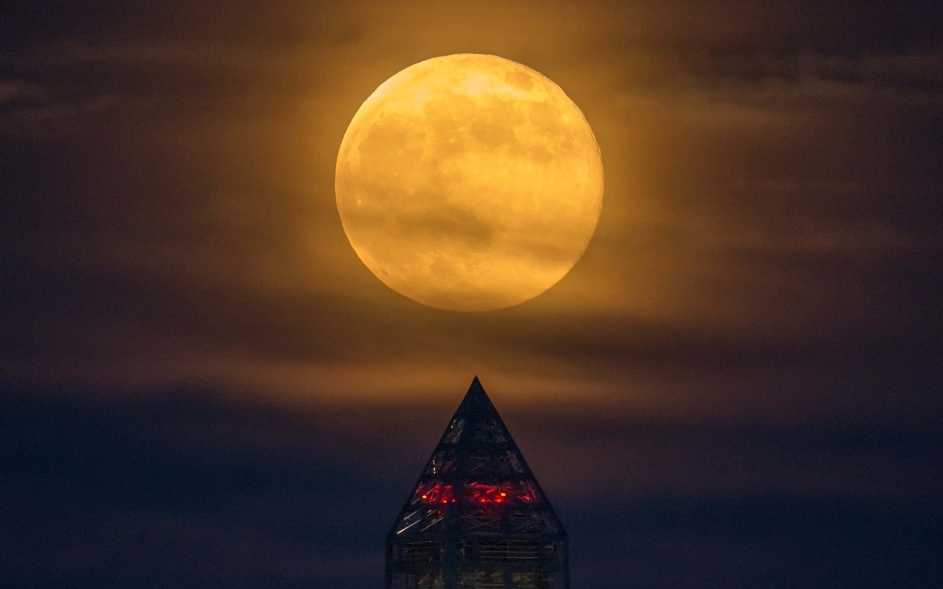 A supermoon rises behind the Washington Monument, Sunday, June 23, 2013, in Washington. This year the Supermoon is up to 13.5% larger and 30% brighter than a typical Full Moon is. This is a result of the Moon reaching its perigee - the closest that it gets to the Earth during the course of its orbit. During perigee on 23 June the Moon was about 221,824 miles away, as compared to the 252,581 miles away that it is at its furthest distance from the Earth (apogee). Photo Credit: (NASA/Bill Ingalls)