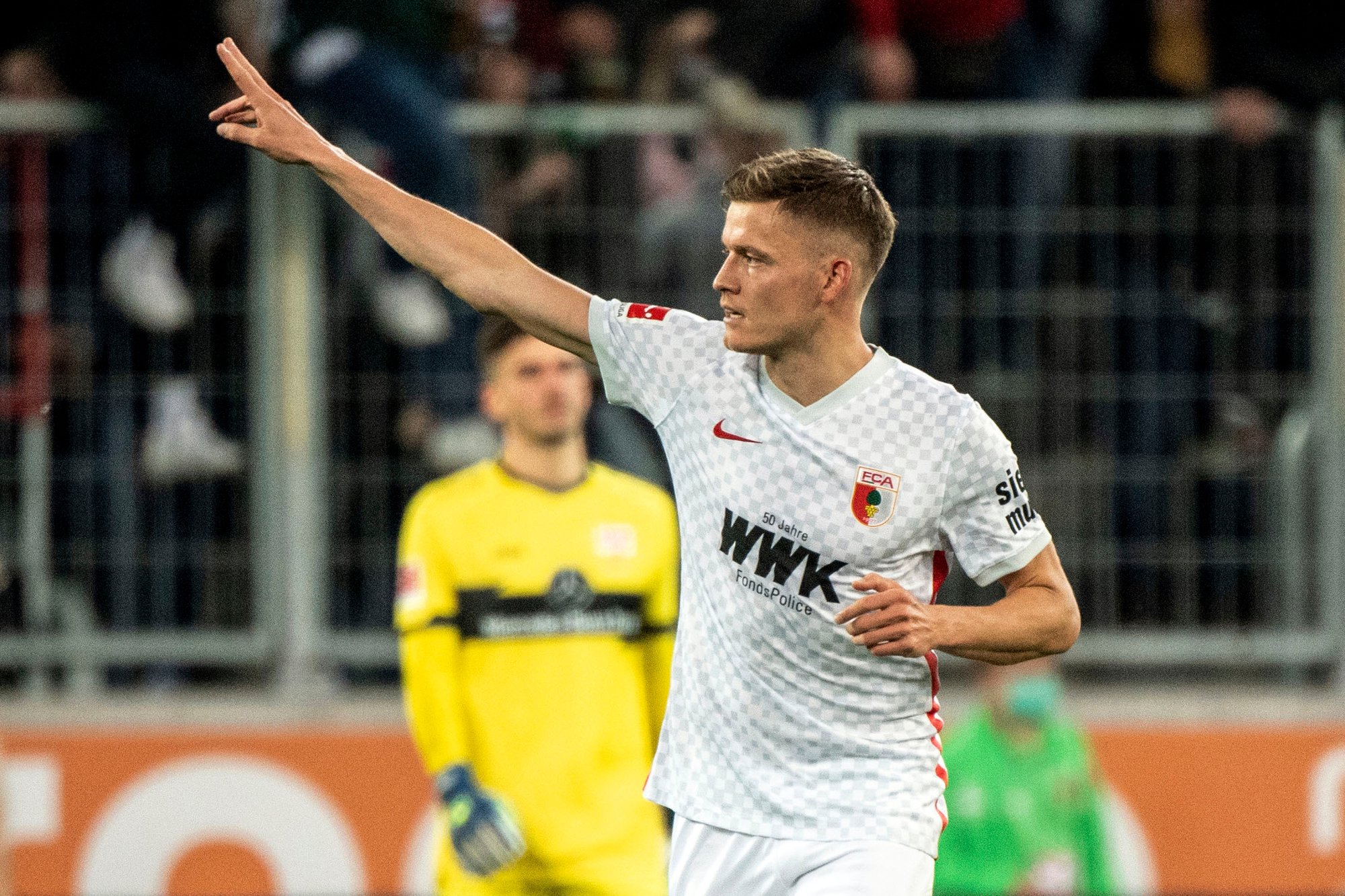 Augsburg's Alfred Finnbogason celebrates scoring during the Bundesliga soccer match between FC Augsburg - VfB Stuttgart at WWK Arena in Augsburg, Germany, Sunday Oct. 31, 2021. (Matthias Balk/dpa via AP)